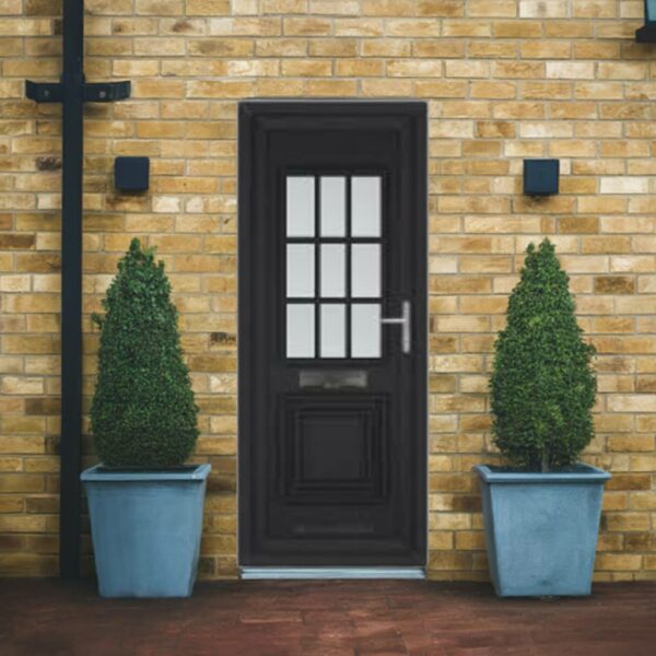 A black uPVC front door with glass panels is set in a yellow brick wall, flanked by two potted, cone-shaped topiary bushes in large blue planters. Two black wall lights sit on either side of the door.